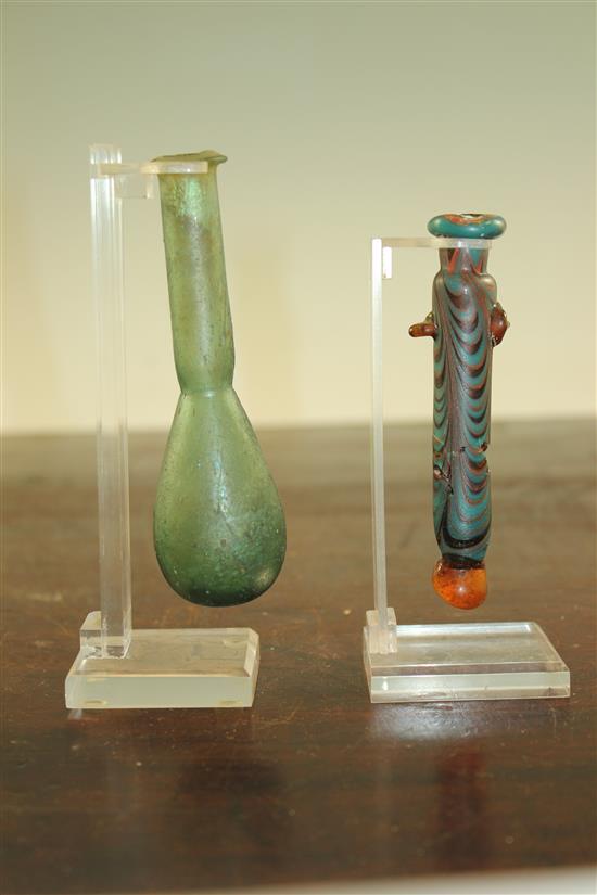 Two Roman glass unguentarium, c. 2nd century A.D., 10.5 and 12cm